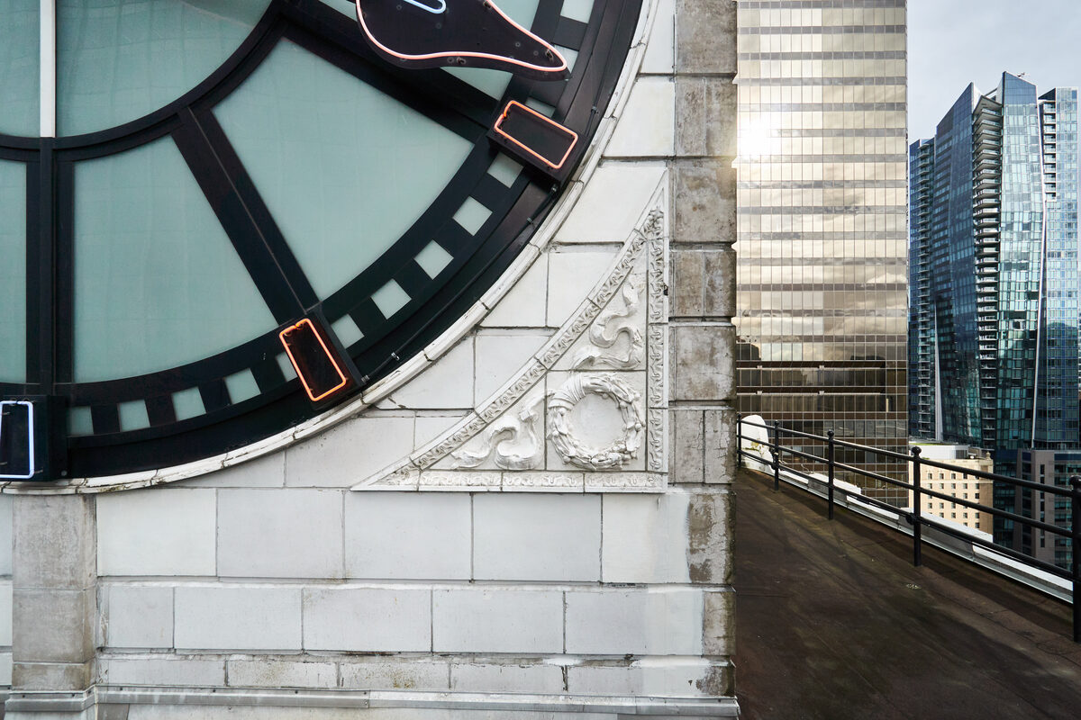 Terracotta rosette ornament on the clock tower corner